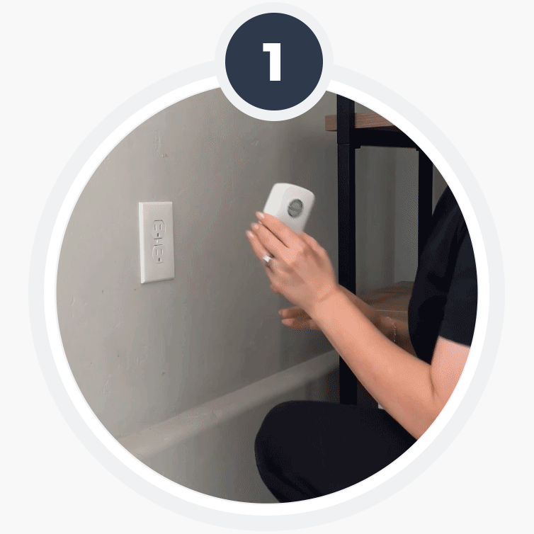 Demonstration of a StopWatt device being plugged into a wall outlet